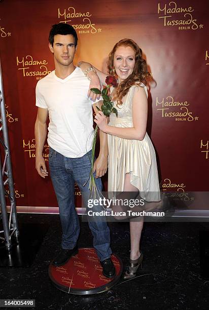 Georgina Fleur poses with the Taylor Lautner wax figure as it is unveiled at Madame Tussauds Berlin on March 19, 2013 in Berlin, Germany.