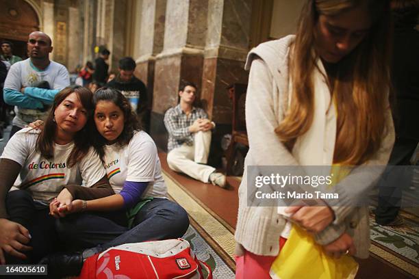 Argentinians gather in Metropolitan Cathedral during a vigil while waiting to watch a live broadcast of the installation of Pope Francis in Saint...