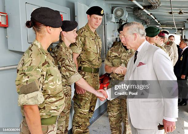 Prince Charles, Prince of Wales talks to Royal Marine Commandos aboard HMS Northumberland, who have been fighting pirates, gun and drug runners in...