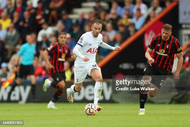 James Maddison of Tottenham Hotspur on the ball ahead of Illya Zabarnyi of AFC Bournemouth during the Premier League match between AFC Bournemouth...