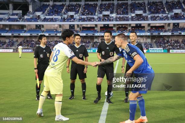 Shuto MINAMI of Montedio Yamagata and MITCHELL DUKE of FC Machida Zelvia shake hands prior to the J.LEAGUE Meiji Yasuda J2 32nd Sec. Match between FC...