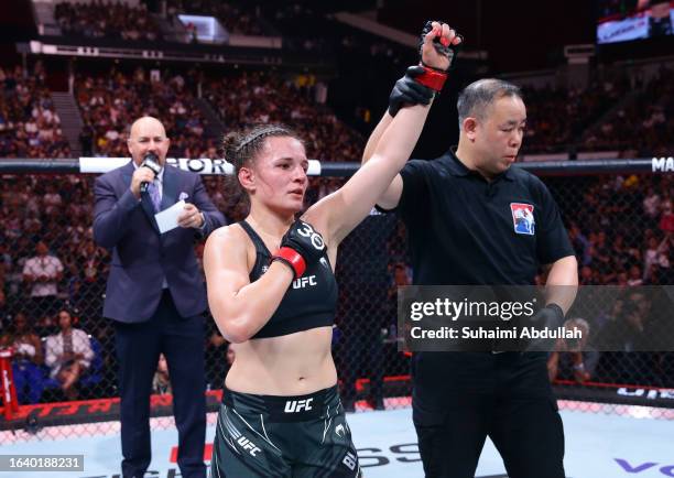 Erin Blanchfield reacts after her victory over Taila Santos of Brazil in a flyweight bout during the UFC Fight Night event at Singapore Indoor...