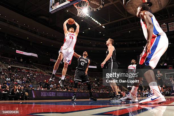Viacheslav Kravtsov of the Detroit Pistons dunks against Jerry Stackhouse of the Brooklyn Nets on March 18, 2013 at The Palace of Auburn Hills in...