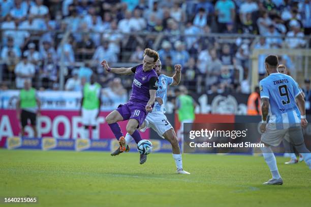 Marlon Frey of 1860 Muenchen and Mirnes Pepic of Aue in action during the 3. Liga match between TSV 1860 Muenchen and Erzgebirge Aue at Stadion an...