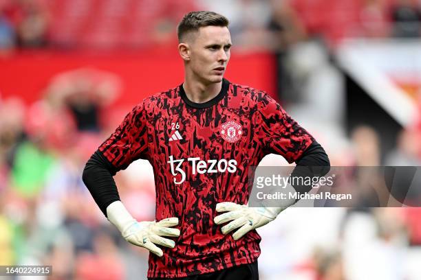 Dean Henderson of Manchester United warms up ahead of the Premier League match between Manchester United and Nottingham Forest at Old Trafford on...