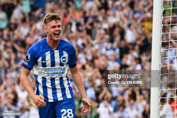 Brighton's Irish striker Evan Ferguson celebrates scoring his team first goal during the English Premier League football match between Brighton and...