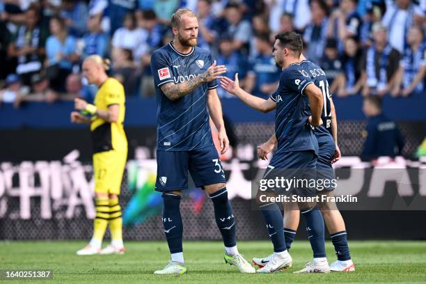 Kevin Stoeger of VfL Bochum celebrates with Philipp Hofmann of VfL Bochum after scoring the team's first goal during the Bundesliga match between VfL...