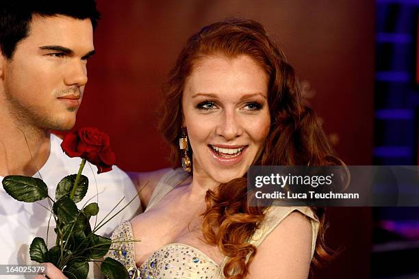 Georgina Fleur poses with the Taylor Lautner wax figure as it is unveiled at Madame Tussauds Berlin on March 19, 2013 in Berlin, Germany.