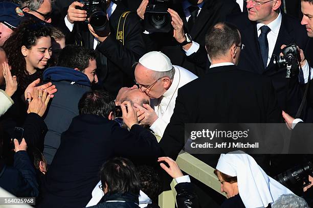 Pope Francis greets members of the faithful as he makes his way around St Peter’s Square on March 19, 2013 in Vatican City, Vatican. The inauguration...