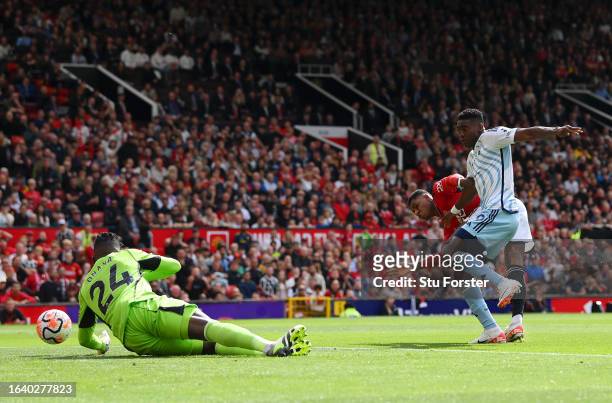 Taiwo Awoniyi of Nottingham Forest scores the team's first goal during the Premier League match between Manchester United and Nottingham Forest at...