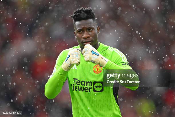 Andre Onana of Manchester United reacts as Christian Eriksen of Manchester United scores the team's first goal during the Premier League match...