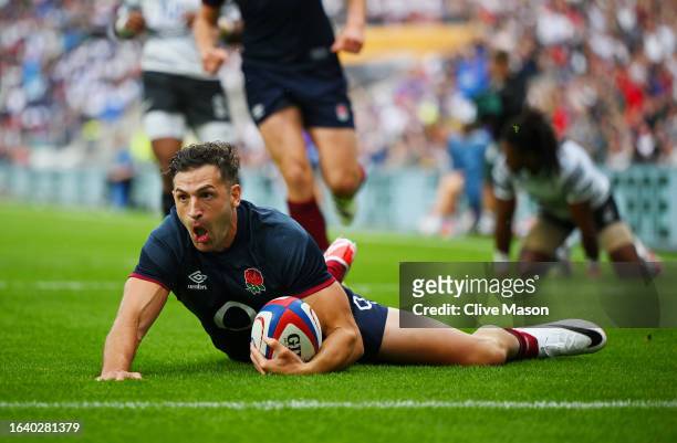 Jonny May of England scores the team's first try during the Summer International match between England and Fiji at Twickenham Stadium on August 26,...