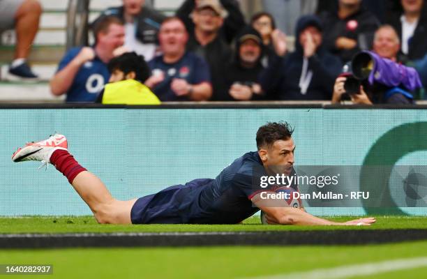 Jonny May of England scores the team's first try during the Summer International match between England and Fiji at Twickenham Stadium on August 26,...