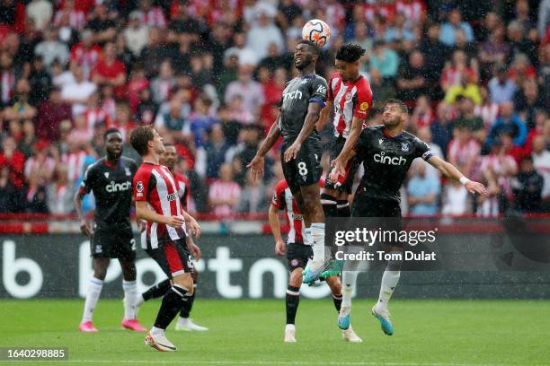 Jefferson Lerma of Crystal Palace and Kevin Schade of Brentford battle for a header during the Premier League match between Brentford FC and Crystal...