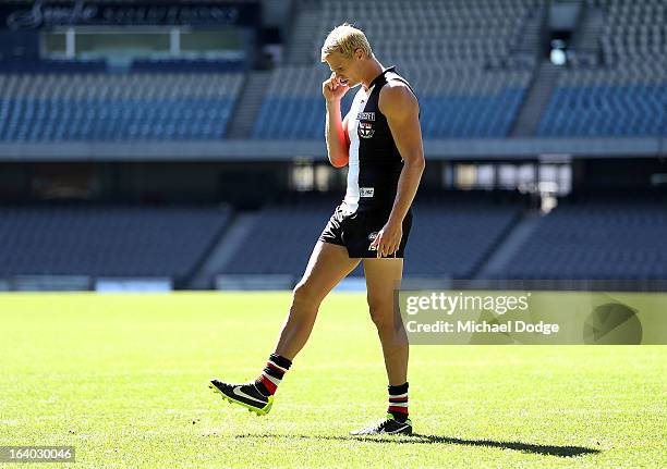 St.Kilda Saints captain Nick Riewoldt talks on the phone to a radio station during the AFL Captains media Day at Etihad Stadium on March 19, 2013 in...