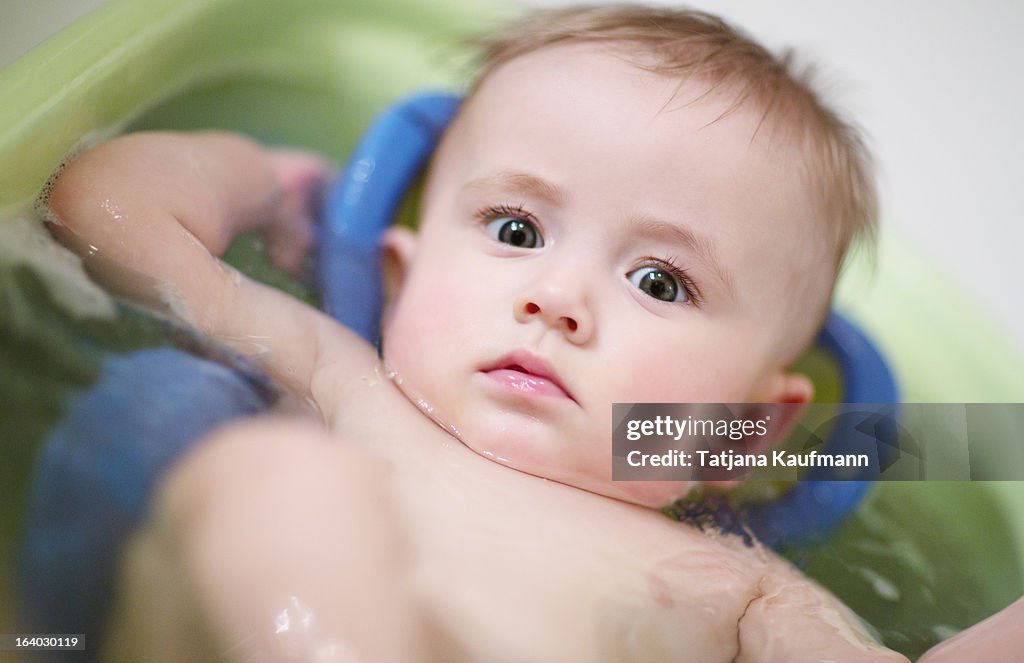 Cute Baby in Bathtub, looking sceptical