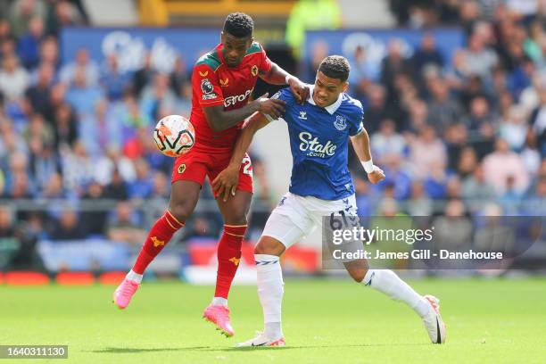 Nelson Semedo of Wolverhampton Wanderers battles for possession with Lewis Dobbin of Everton during the Premier League match between Everton FC and...