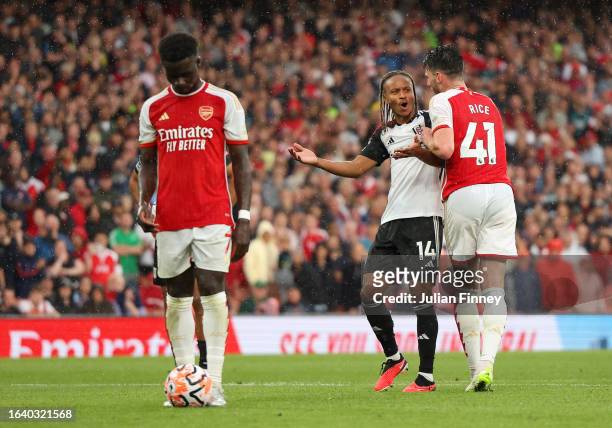 Declan Rice of Arsenal clashes with Bobby De Cordova-Reid of Fulham before the Arsenal penalty taken by Bukayo Saka during the Premier League match...