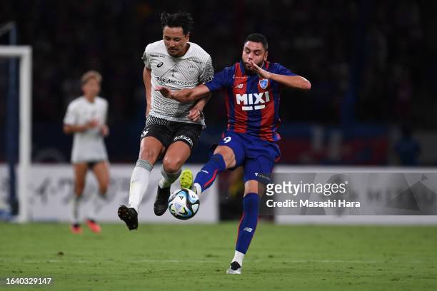 Diego Oliveira of FC Tokyo and Leo Osaki of Vissel Kobe compete for the ball during the J.LEAGUE Meiji Yasuda J1 25th Sec. Match between F.C.Tokyo...