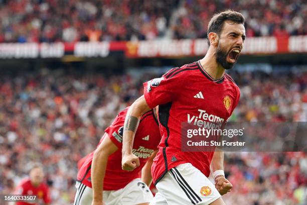 Bruno Fernandes of Manchester United celebrates after scoring the team's third goal from the penalty-spot during the Premier League match between...