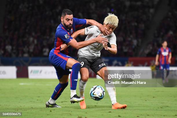 Diego Oliveira of FC Tokyo and Ryo Hatsuse of Vissel Kobe compete for the ball during the J.LEAGUE Meiji Yasuda J1 25th Sec. Match between F.C.Tokyo...