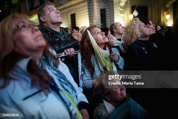 Argentinians gather in Plaza de Mayo while watching a live broadcast of the installation of Pope Francis in Saint Peter's Square on March 19, 2013 in...