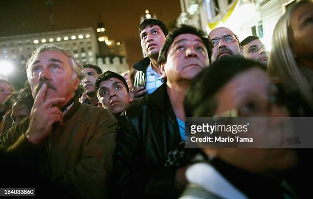 Argentinians gather in Plaza de Mayo while watching a live broadcast of the installation of Pope Francis in Saint Peter's Square on March 19, 2013 in...