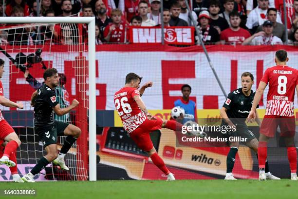 Maximilian Philipp of Sport-Club Freiburg scores the team's first goal during the Bundesliga match between Sport-Club Freiburg and SV Werder Bremen...