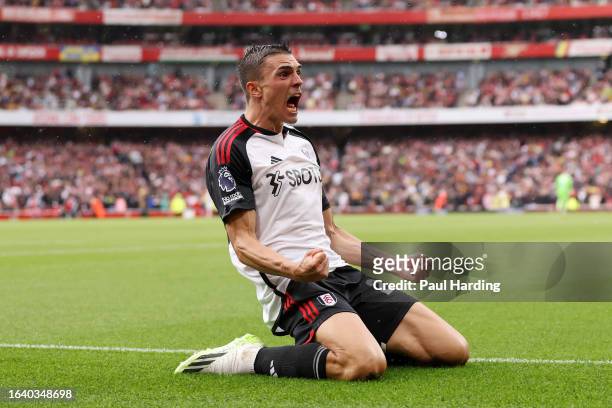 Joao Palhinha of Fulham celebrates after scoring the team's second goal during the Premier League match between Arsenal FC and Fulham FC at Emirates...