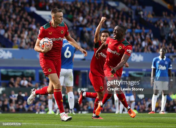 Sasa Kalajdzic of Wolverhampton Wanderers celebrates after scoring the team's first goal during the Premier League match between Everton FC and...