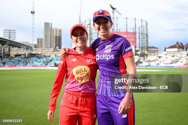 Alex Hartley of Welsh Fire poses for a photograph with Kate Cross of Northern Superchargers after the match is abandoned following a Storm and...