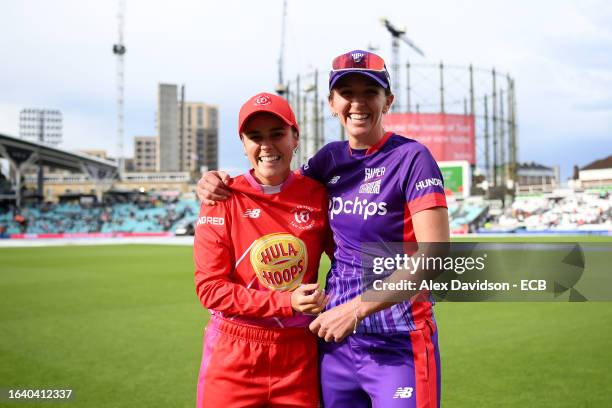 Alex Hartley of Welsh Fire poses for a photograph with Kate Cross of Northern Superchargers after the match is abandoned following a Storm and...