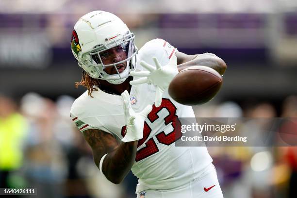 Corey Clement of the Arizona Cardinals warms up prior to the start of a preseason game against the Minnesota Vikings at U.S. Bank Stadium on August...
