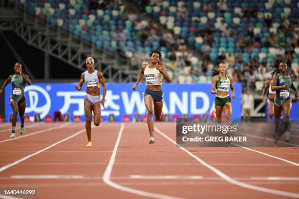 Marileidy Paulino of Dominican Republic wins the women's 400m event during the Diamond League athletics meeting in Xiamen, in China's eastern Fujian...