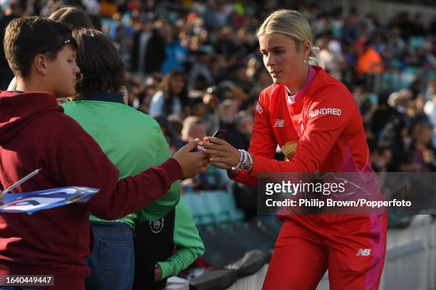 Alex Hartley of Welsh Fire signs autographs after The Hundred Eliminator match between Northern Superchargers Women and Welsh Fire Women at The Kia...