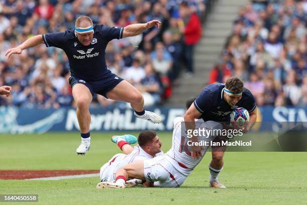 Rory Darge of Scotland is tackled by Luka Matkava of Georgia during the Summer International match between Scotland and Georgia at BT Murrayfield...