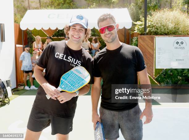 David Dobrik and Taylor Lautner pose at the CELSIUS pickleball tournament at David Dobrik’s home on August 25, 2023 in Sherman Oaks, California.