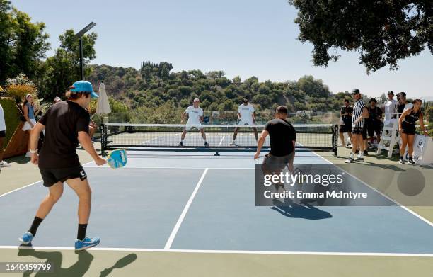 David Dobrik, Tyler Cameron, Matt James, and Taylor Lautner play in the CELSIUS pickleball tournament at David Dobrik’s home on August 25, 2023 in...