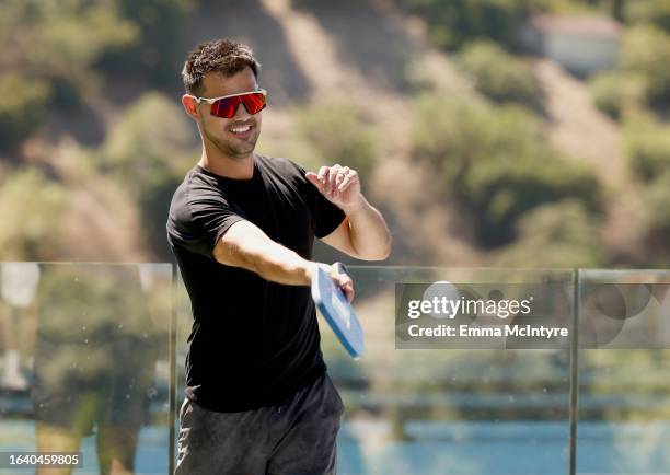 Taylor Lautner plays in the CELSIUS pickleball tournament at David Dobrik’s home on August 25, 2023 in Sherman Oaks, California.