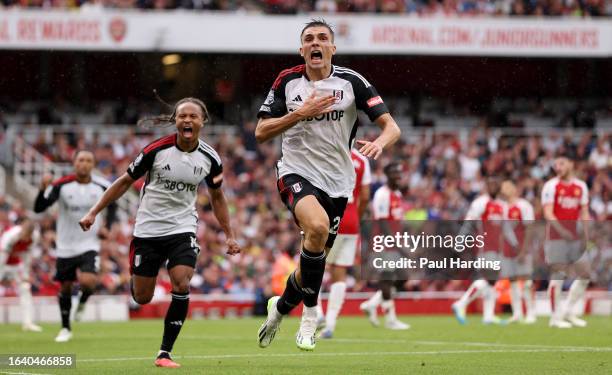 Joao Palhinha of Fulham celebrates after scoring the team's second goal during the Premier League match between Arsenal FC and Fulham FC at Emirates...