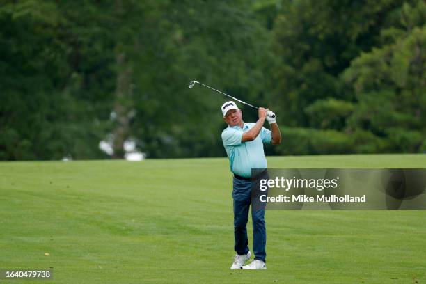 Mark O'Meara of the United States hits an approach shot on the 10th hole during the first round of the The Ally Challenge presented by McLaren at...