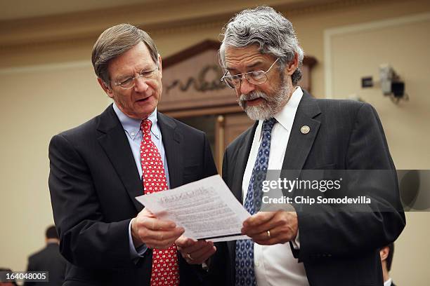 House Science, Space and Technology Committee Chairman Lamar Smith looks over some data with White House Office of Science and Technology Policy...