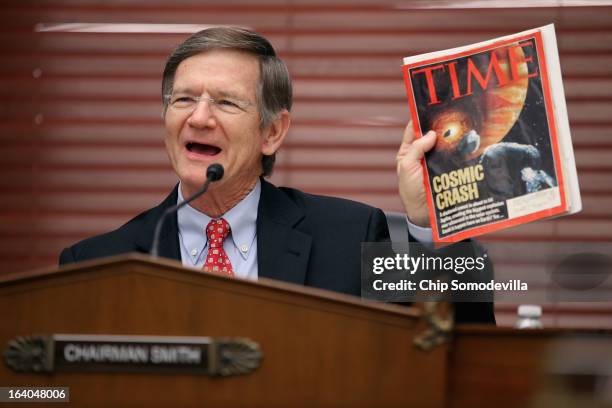 House Science, Space and Technology Committee Chairman Lamar Smith holds up a copy of TIME Magazine with a cover article about 'near-Earth objects'...