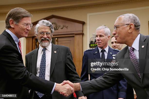 House Science, Space and Technology Committee Chairman Lamar Smith greets White House Office of Science and Technology Policy Director John Holdren;...