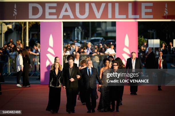 French film director Luc Besson arrives with the cast and crew of his film "Dogman" US actress Marisa Berenson, US actor Caleb Landry Jones, his...