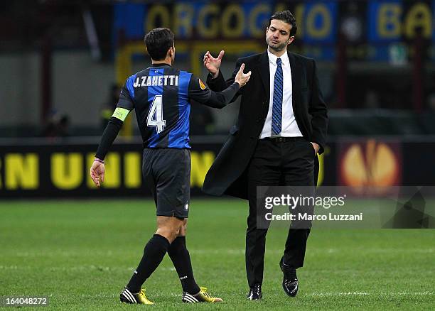 Internazionale Milano manager Andrea Stramaccioni shakes hands with his player Javier Zanetti at the end of the UEFA Europa League Round of 16 Second...