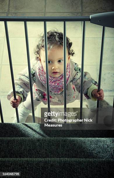 baby girl - baby gate imagens e fotografias de stock