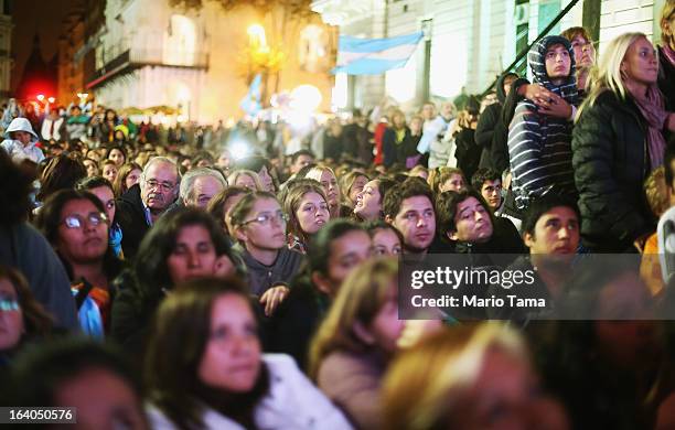 Argentinians gather in Plaza de Mayo while watching a live broadcast of the installation of Pope Francis in Saint Peter's Square on March 19, 2013 in...