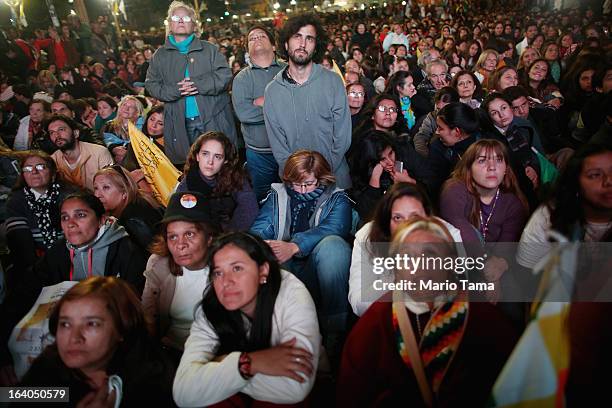 Argentinians gather in Plaza de Mayo while watching a live broadcast of the installation of Pope Francis in Saint Peter's Square on March 19, 2013 in...