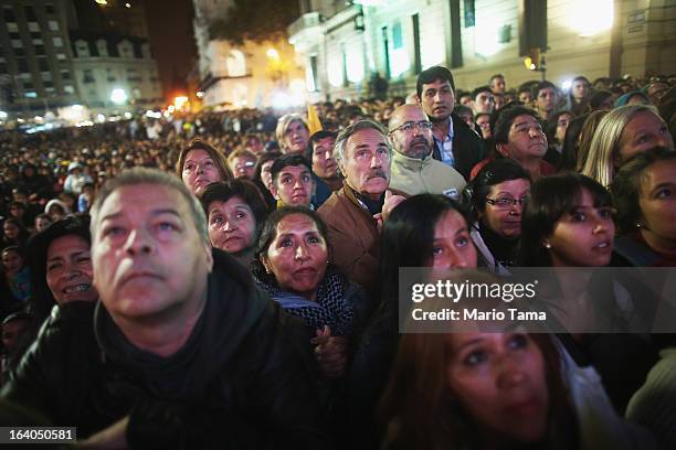 Argentinians gather in Plaza de Mayo while watching a live broadcast of the installation of Pope Francis in Saint Peter's Square on March 19, 2013 in...